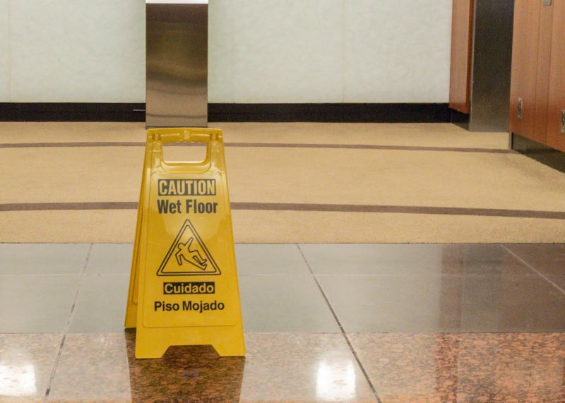iCleaners hard floor care services wet floor sign in office building lobby
