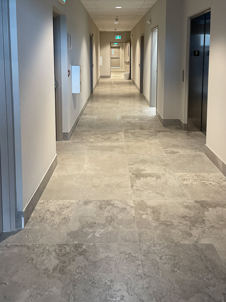 iCleaners commercial office space. Showing a hallway that has been mopped and cleaned.